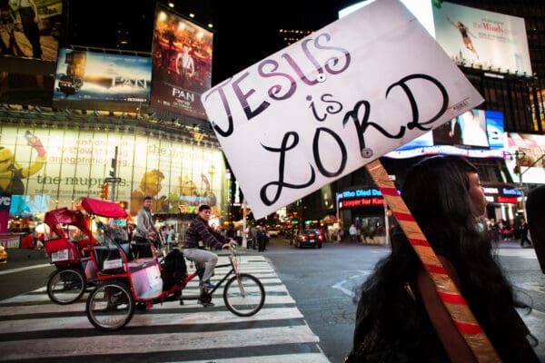 Lisa Johnston | lisajohnston@archstl.org  | Twitter: @aeternusphoto The second stop in the United States for Pope Francis is New York City, NY. He was welcomed on the first night be thousands filling the streets trying to get a glimpse of his white cassock and zucchetto. In Times Square Coco McCoy had a different way of evanglizing. She has been comming to Times Square for about a year now with her sign.