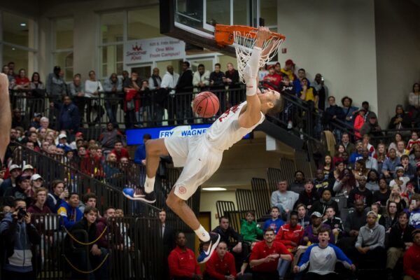 Lisa Johnston  |  lisajohnston@archstl.org  |  @aeternusphoto  Jayson Tatum held the rim after a slam dunk in the fourth periord. Tatum lead the Chaminade Red Devils to a win over rival Christian Brothers College 79-57,  The senior finished with 39 points, nine rebounds, four assists and a steal.  The game was played at Hyland Arena on the campus of Lindenwood University in St. Charles.