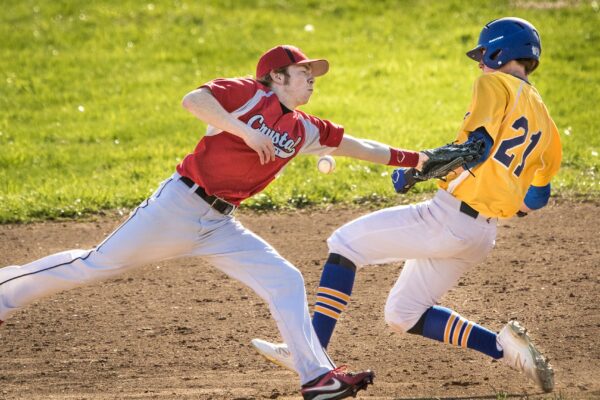 Lisa Johnston | lisajohnston@archstl.org | Twitter: @aeternusphoto
Crystal City's second baseman, Logan Grove missed the throw allowin St. Vincent's Noah Niswonger to gain second base. 
St. Vincent High School out scored their opponents, Crystal City High School in a baseball game March 28.