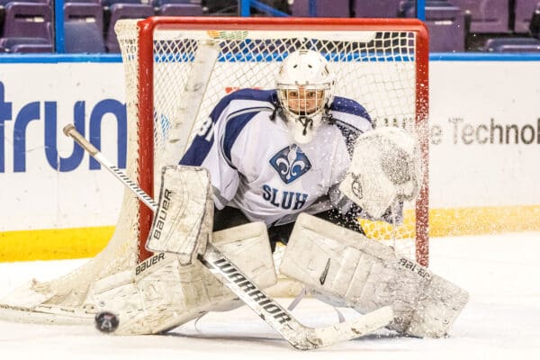 Lisa Johnston | lisajohnston@archstl.org | Twitter: @aeternusphoto

St. Louis University High's Brendan Rasch stopped this potential goal but his team still lost the game to CBC 4-1.In the Mid-States Club Hockey Association playoffs at the Scottrade Center Downtown, CBC defeated rival St. Louis University High School 4-1.