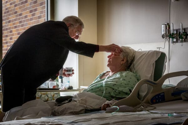 Lisa Johnston  |  lisajohnston@archstl.org  |  twitter: @aeternusphoto 

Deacon Jerry Stoverink distributed ashes to Dorothy Wilfong, a parishioner at Immaculate Conception in Arnold.  Wilfong had undergone knee replacement and was thankful that the deacon stopped in to her room. The chaplaincy at Mercy Hospital Jefferson in Festus distributed ashes to the hospital's patients on Feb. 14, 2018.