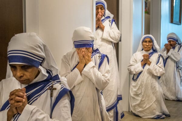 Lisa Johnston  |  lisajohnston@archstl.org  |  Twitter: @aeternusphoto  

Bishop Mark Rivituso celebrated Mass for the Missionaries of Charities at their new soup kitchen on Aug. 16, 2018.  Sisters prayed in the hallway after receiving the Eucharist during Mass.