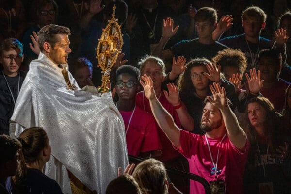 Father Michael Schmitz, director of Youth and Young Adult Ministry for the Diocese of Duluth processed with the Eucharist through the arena where more than 5,000 prayed in adoration at Steubenville STL Mid-America youth conference in Springfield, MO on Saturday, Jul. 13, 2019. 

Lisa Johnston | lisajohnston@archstl.org  | Twitter: @aeternusphoto