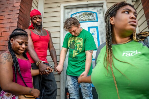 Patricia Henderson, Ifiok Usanga, Daniel Andrews and Dana Holden held hands during a prayer vigil held for his 7-year-old son, Xavier Usanga, who was shot an killed outside his home across the street from Most Holy Trinity Parish on the 3500 block of North 14th Street in St. Louis, MO on Wednesday, Aug. 14, 2019.  

Lisa Johnston | lisajohnston@archstl.org  | Twitter: @aeternusphoto