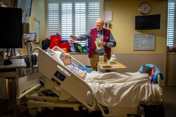 Retired pastor, Father Robert Roseborough blessed Jamie-Lynn Haley after he read an interactive book to her titled "Would You Rather?" at SSM Health Cardinal Glennon Children’s Hospital  in St. Louis, Missouri on Wednesday, Mar 04, 2020.

Lisa Johnston | lisajohnston@archstl.org  | Twitter: @aeternusphoto