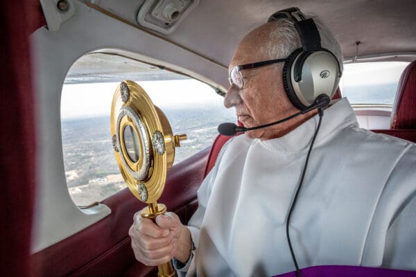 Deacon Tom Gerling, of Our Lady Queen of Peace Catholic Church in House Springs looked out the window while holding a monstrance containing the Eucharist. He flew with Father John Schmitz of Diocese of Jefferson City, a licensed pilot, flew in a Cessna Cardinal plane over the Festus deanery of the Archdiocese of St. Louis with Jesus in the Blessed Sacrament. They blessed and prayed over 12 parishes for healing during the Corona virus pandemic. The plane flew out of at Spirit of St. Louis airport in Chesterfield, Missouri on Wednesday, March 25, 2020. 

Lisa Johnston | lisajohnston@archstl.org  | Twitter: @aeternusphoto