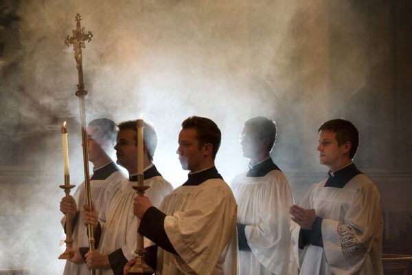 Seminarians walk down the main aisle of the chapel in procession.